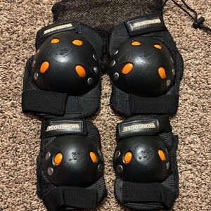 Mongoose Black and Orange Protective Pads for knees and a elbows in mesh bag